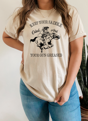 GRAPHIC TEE 576S Keep Your Saddle Oiled And Your Gun Greased